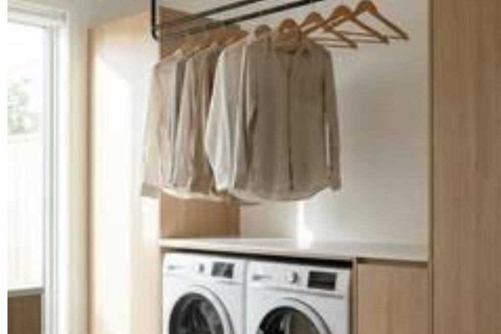Laundry room hanging rod above stacked washer and dryer