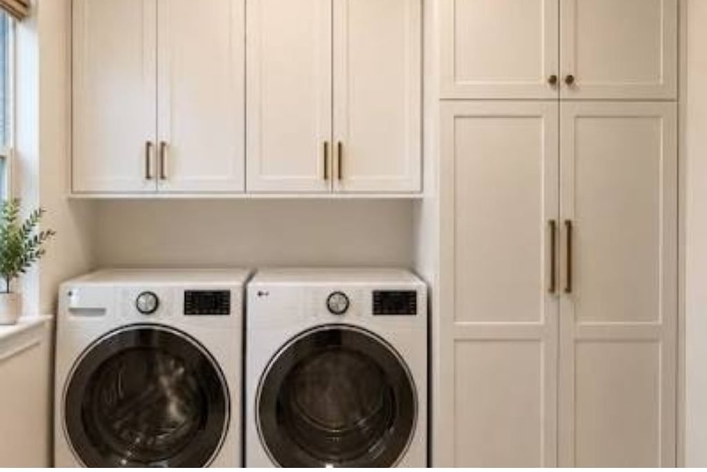 Modern laundry closet with organized drawers and white appliances