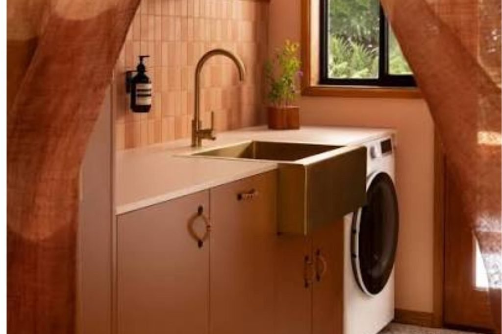 Neutral fall laundry room with terracotta and beige accents