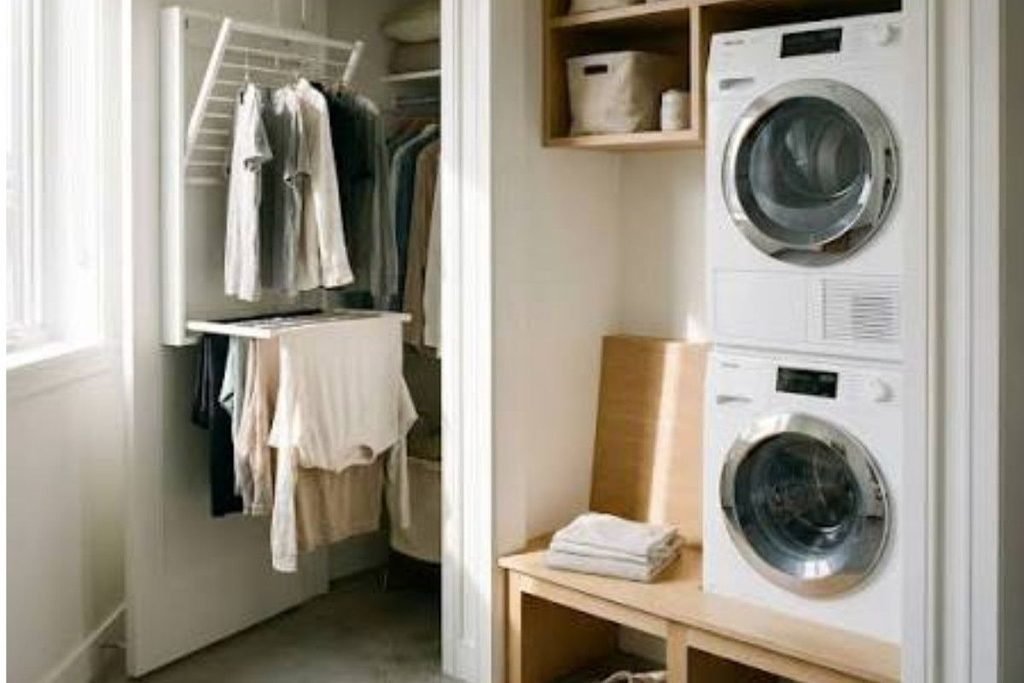 Small laundry closet with collapsible fabric sorting